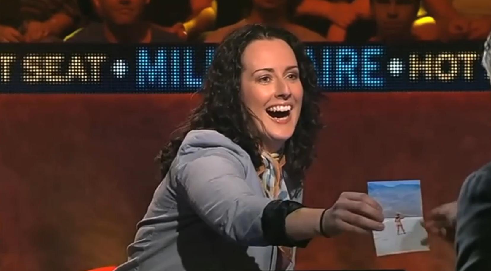 Nat showing Eddie her bum on Millionaire HotSeat Screen grab- Ch 9