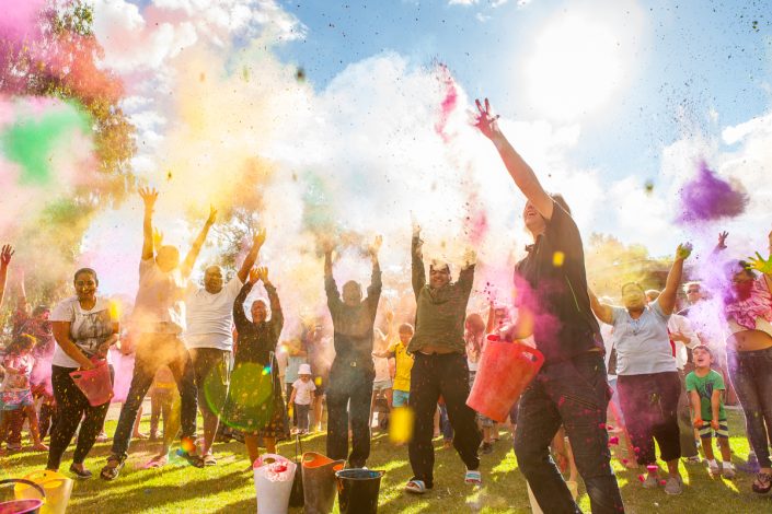 Holi Festival, Albury event photography of people throwing coloured powder in the air